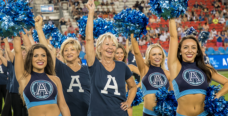 Argos alumni cheerleaders performing wearing custom printed t-shirts.