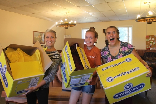 Consumers excited to receive their custom designed merch from entripy in the yellow box.