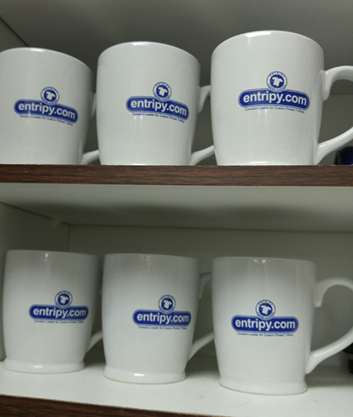 Entripy branded custom mugs displayed for client and employee use.