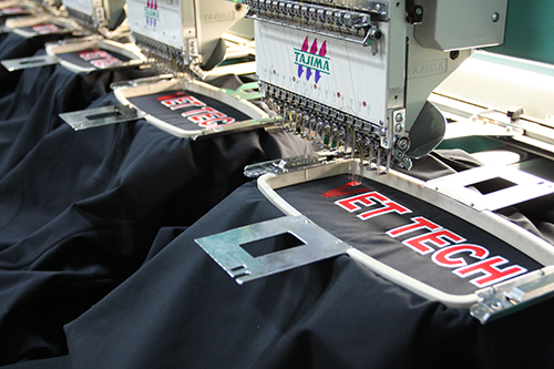 Embroidery machines for custom apparel. Lasting high quality embroidered custom clothing.