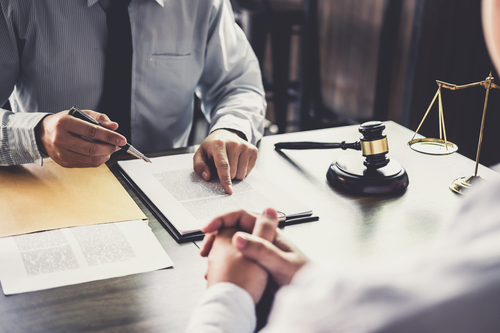 Lawyers processing the legal paperwork required to setup an official business