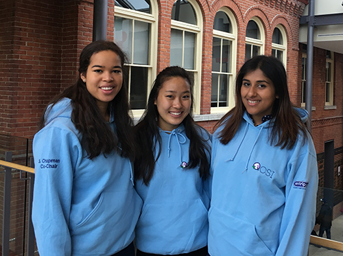 Custom blue sweatshirts worn by students at university with their school custom logo.