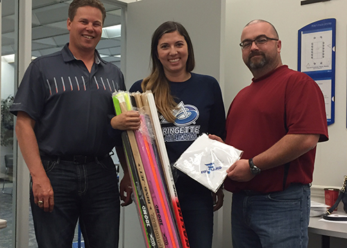 Ringette Alberta management wearing their custom apparel & showcasing custom promo products.