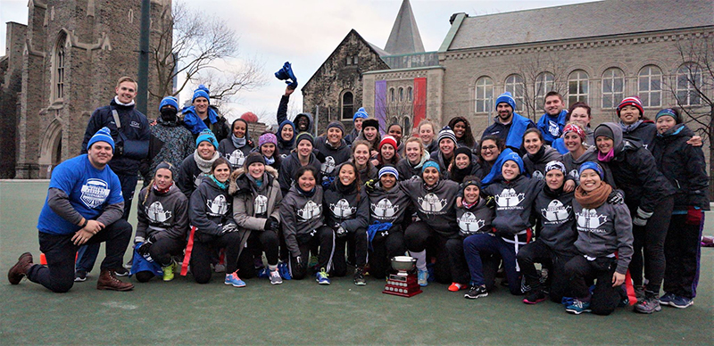 Entripy clients wearing custom jackets along with embroidered toques and custom t-shirts.