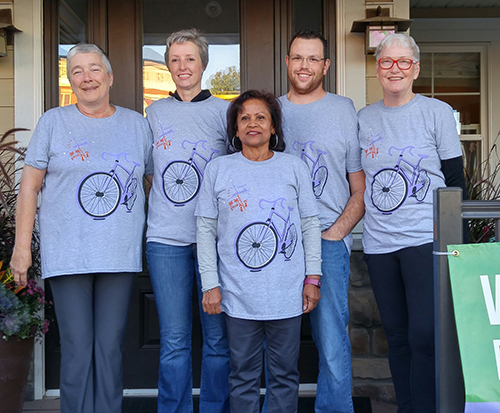 Participants for a bicycle charity event wearing custom t-shirts with custom design graphic.