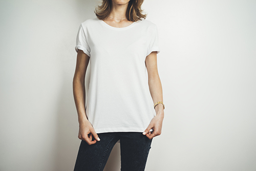 Model wearing white custom printed t-shirt.