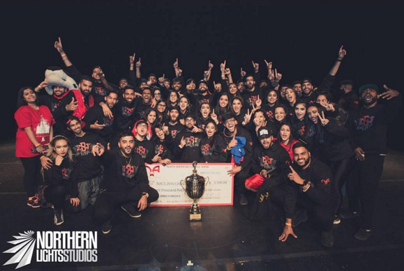 Winners of the Culture show displaying their award, custom sweatshirts and custom t-shirts with their school design.