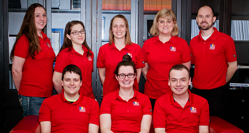 Entripy clients wearing red custom polos for their organization.