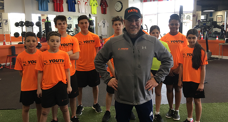 Gym class team wearing custom t-shirts and coach wearing custom hats with Under Armour crewneck.