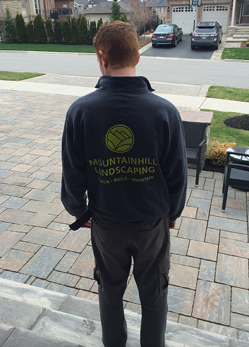 Entripy client wearing customized sweatshirt with company logo.