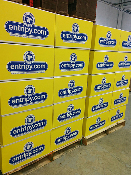 Entripy clients receive yellow boxes with entripy logo for their custom apparel orders.