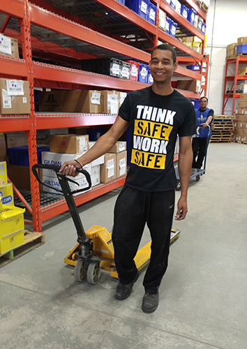 Entripy employee wearing custom printed t-shirt in the warehouse.