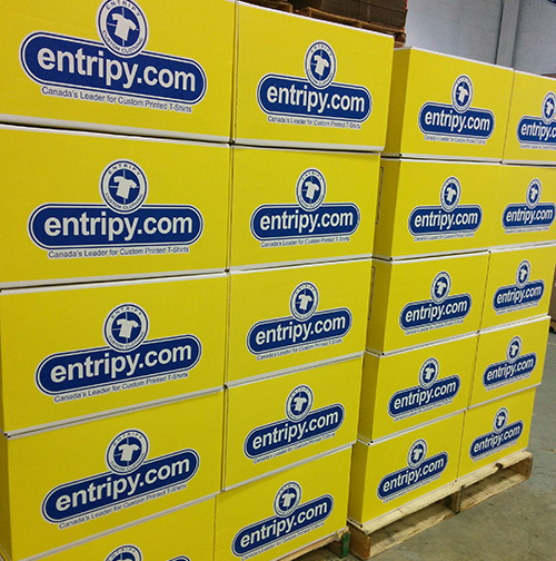 Entripy's yellow box for packaging all custom apparel orders.