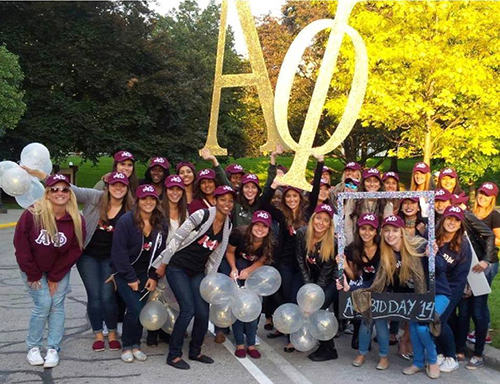 Frosh week students wearing custom logo hats with their custom school gear.