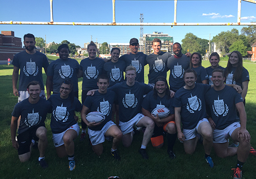 Participants in a soccer club posing as a group wearing custom printed t-shirts and customized shorts.