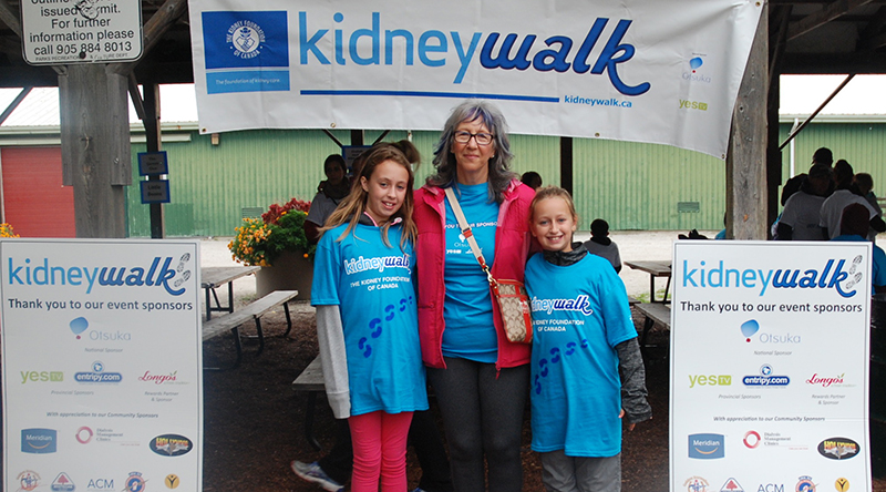 Volunteers wearing custom t-shirts at Kidney Walk charity event.