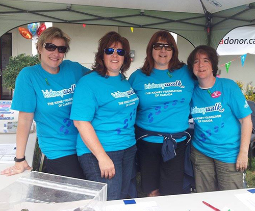 Kidney walk volunteers wearing blue custom t-shirts raising money for the event.