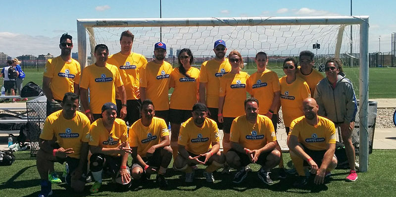 Entripy employees wearing yellow athletic custom printed t-shirts for MLSE Team Up Challenge.