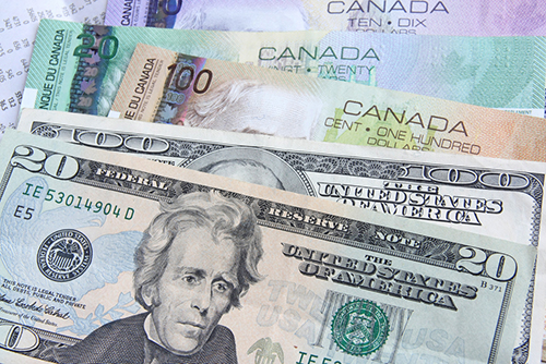 US currency and Canadian dollars depicting the cost savings companies will endure with Entripy.