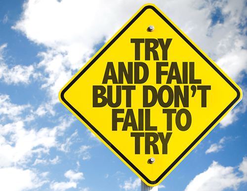 Quote on a sign about trying and not failing.