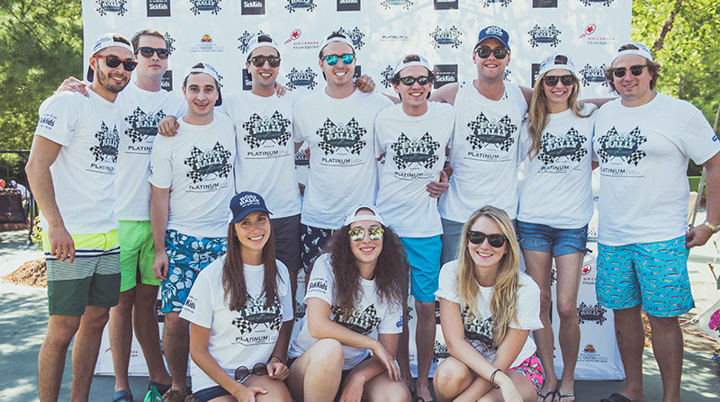 Rally for kids white custom t-shirts worn by a group of people at the event.