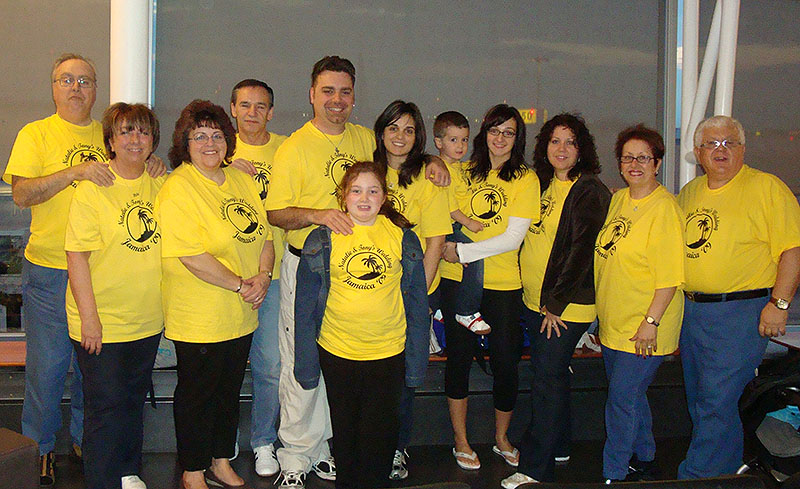 Group of family members at their family reunion with yellow custom t-shirts.