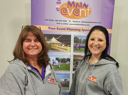 Event planning company at a tradeshow wearing custom sweatshirts with their custom logo.