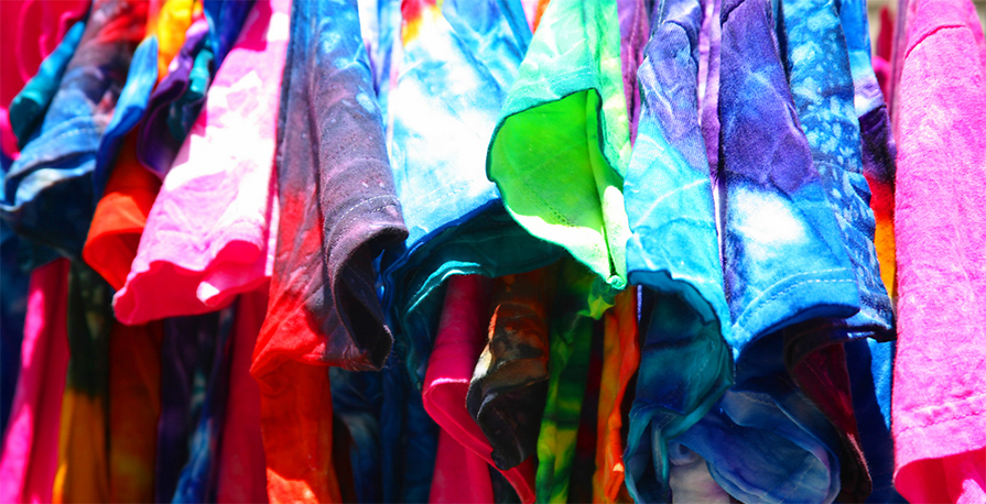 Hung up custom t-shirts with tie dye patterns used to be screen printed with custom logo or design.