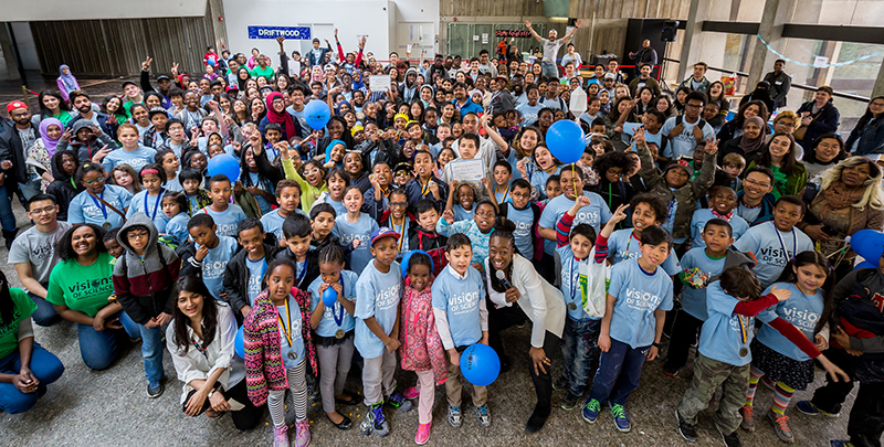 Youth wearing blue custom printed t-shirts at Visions of Science organization for youth.