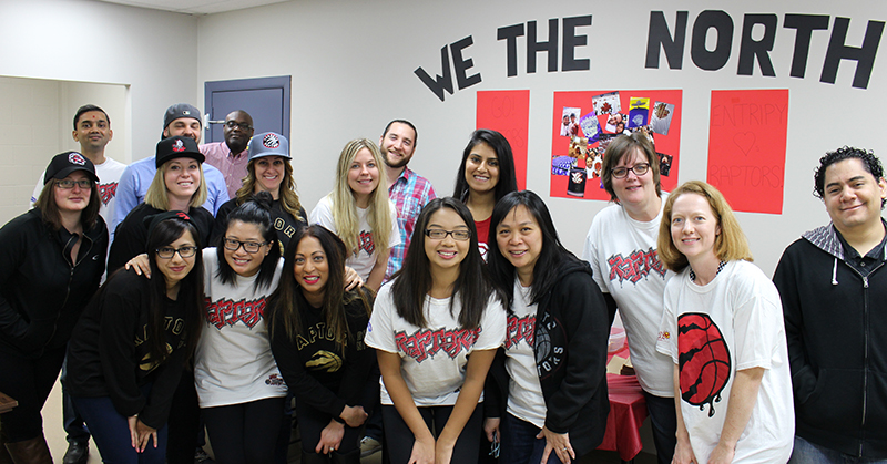 Entripy employees wearing custom t-shirts and custom toques for Raptors playoffs.