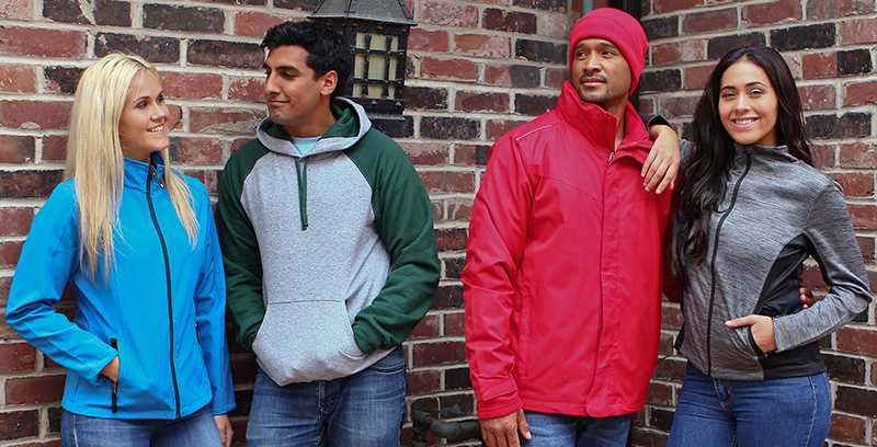 Group of people wearing custom apparel including custom jackets, embroidered jackets & custom toque.