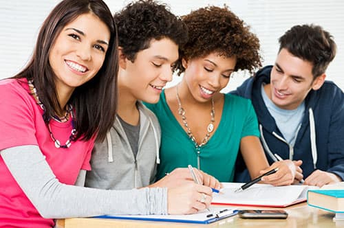 Students in class showing school spirit wearing custom clothing.